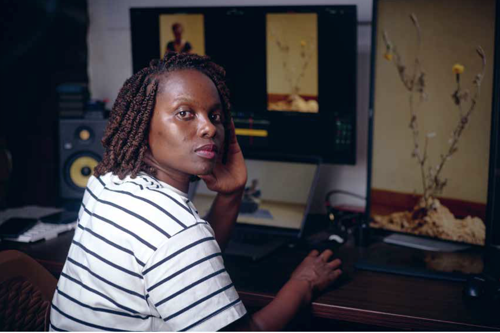 Rehema Chachage editing her films for the exhibition Amani kukita | kung'oa